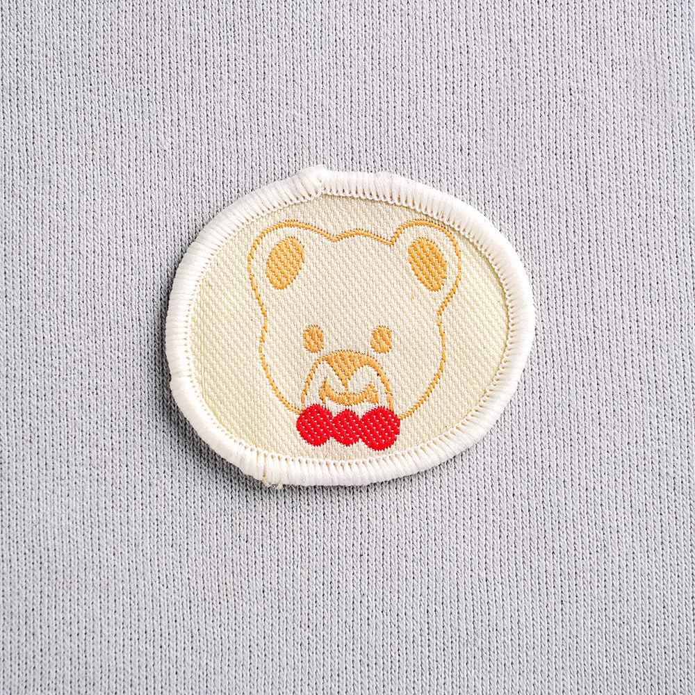 Аппликация пришивная 015S Эмблема (50 шт.)